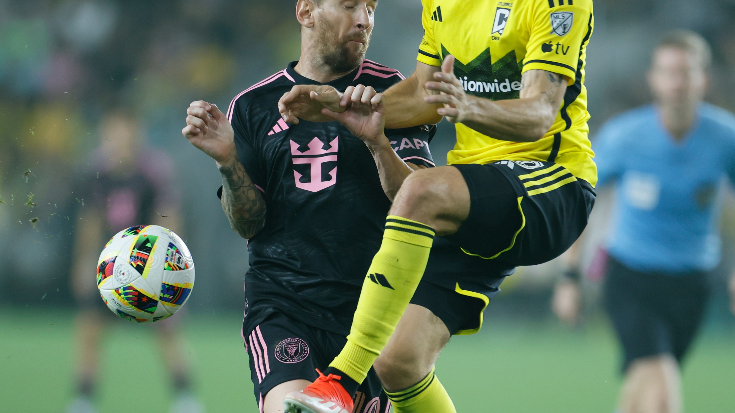 Inter Miami's Lionel Messi, left, collides with Columbus Crew's Malte Amundsen during the second half of an MLS soccer match, Wednesday, Oct. 2, 2024, in Columbus, Ohio. (AP Photo/Jay LaPrete)