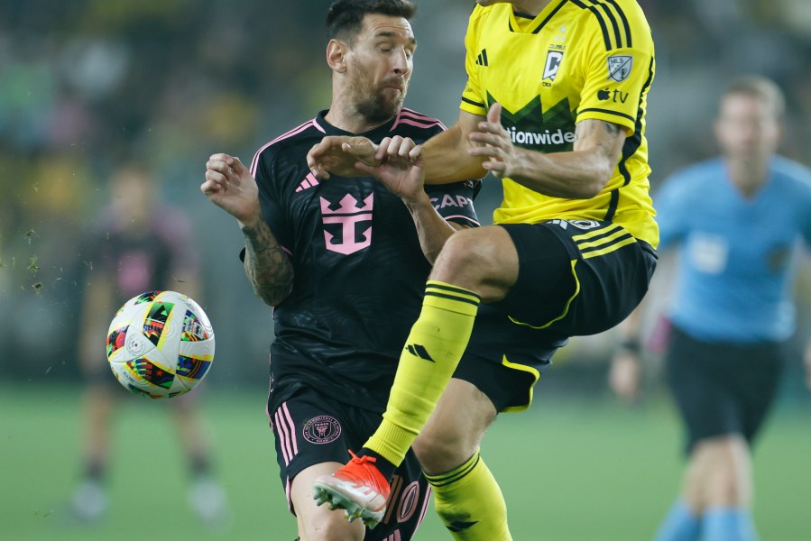 Inter Miami's Lionel Messi, left, collides with Columbus Crew's Malte Amundsen during the second half of an MLS soccer match, Wednesday, Oct. 2, 2024, in Columbus, Ohio. (AP Photo/Jay LaPrete)