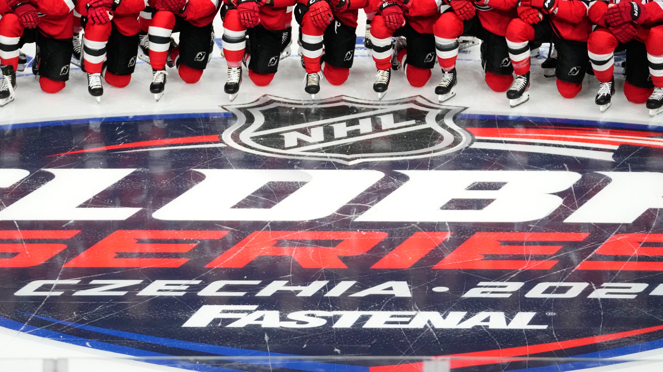 New Jersey Devils' players pose for a photo ahead of a practice session, a day before their NHL hockey game against Buffalo Sabres, in Prague, Czech Republic, Thursday, Oct. 3, 2024. (AP Photo/Petr David Josek)