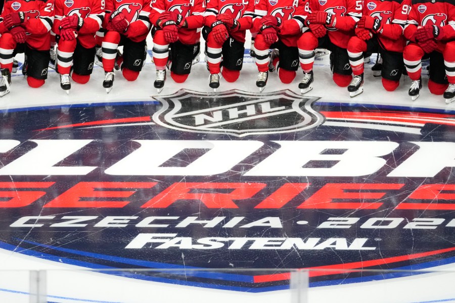 New Jersey Devils' players pose for a photo ahead of a practice session, a day before their NHL hockey game against Buffalo Sabres, in Prague, Czech Republic, Thursday, Oct. 3, 2024. (AP Photo/Petr David Josek)