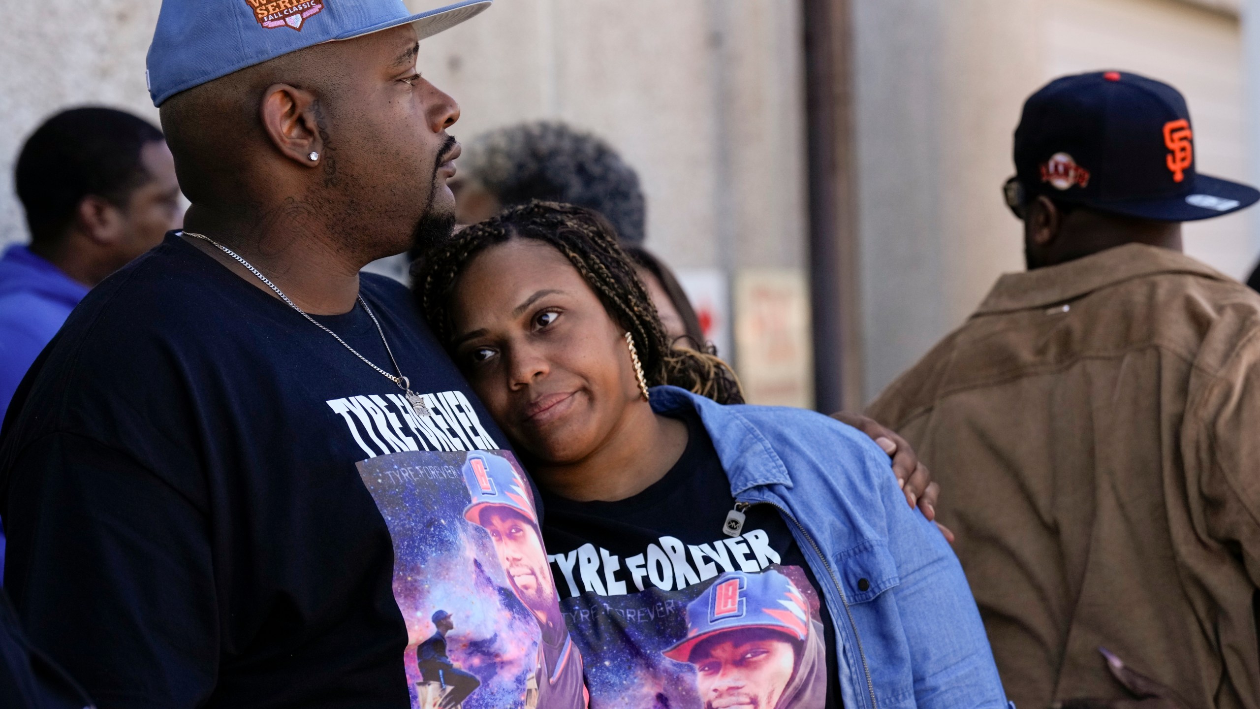 Jamal Dupree, left, and La'Toya Yizar, right, comfort each other during a prayer vigil outside the federal courthouse as jury deliberations begin for the trial of three former Memphis police officers charged in the 2023 fatal beating of their brother, Tyre Nichols, Thursday, Oct. 3, 2024, in Memphis, Tenn. (AP Photo/George Walker IV)