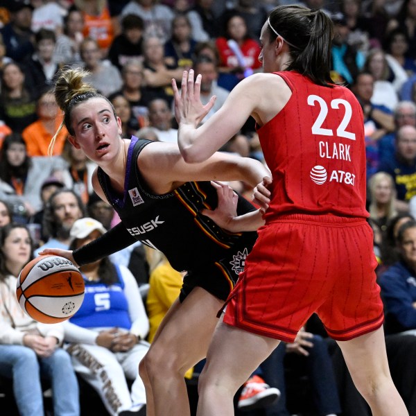 Connecticut Sun guard Marina Mabrey, left, is guarded by Indiana Fever guard Caitlin Clark during the second half of a first-round WNBA basketball playoff game, Wednesday, Sept. 25, 2024, in Uncasville, Conn. (AP Photo/Jessica Hill)