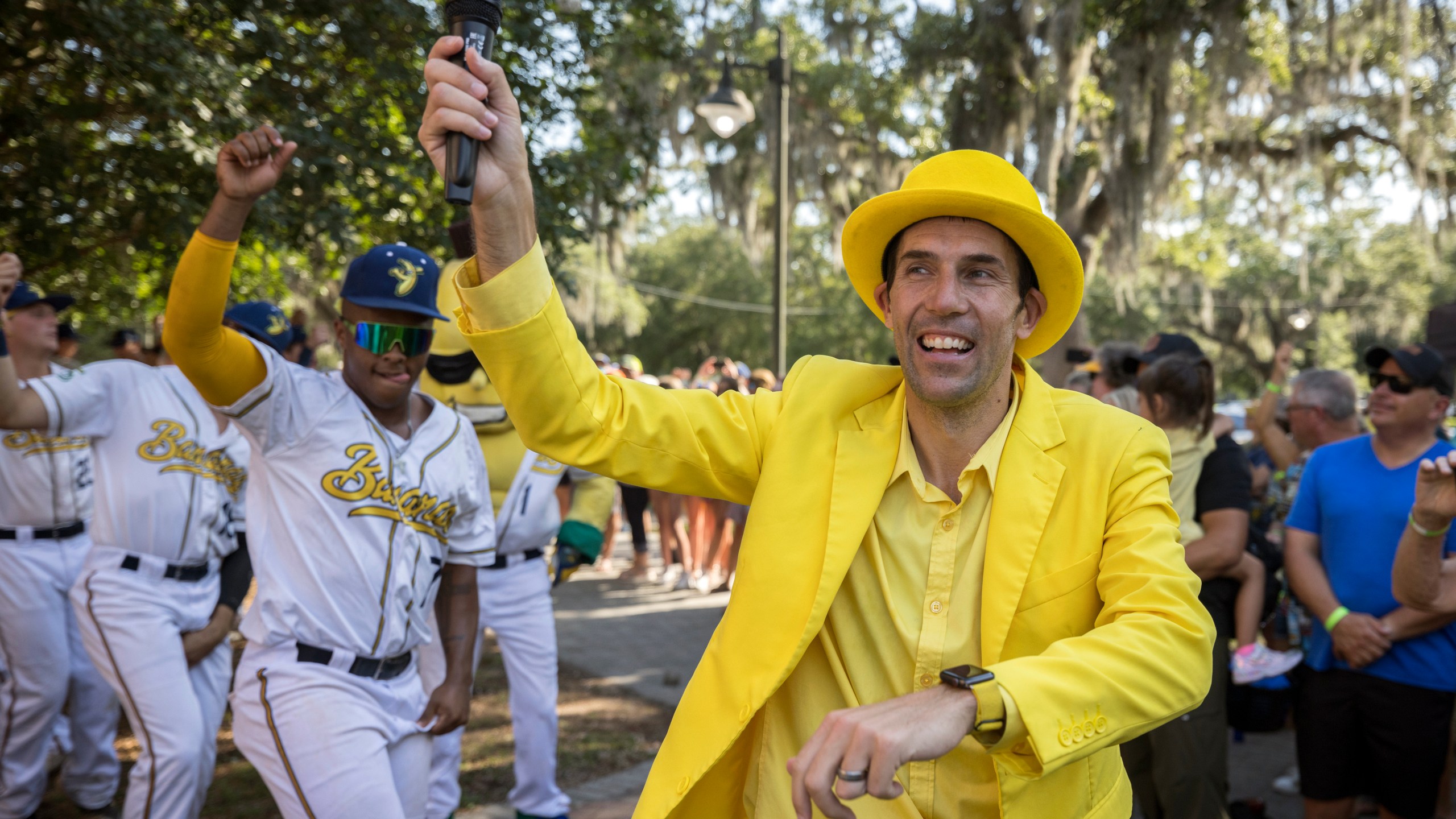 FILE - Savannah Bananas owner Jesse Cole emcees a pregame parade and performance for the fans before the gates open, June 7, 2022, in Savannah, Ga. (AP Photo/Stephen B. Morton, File)