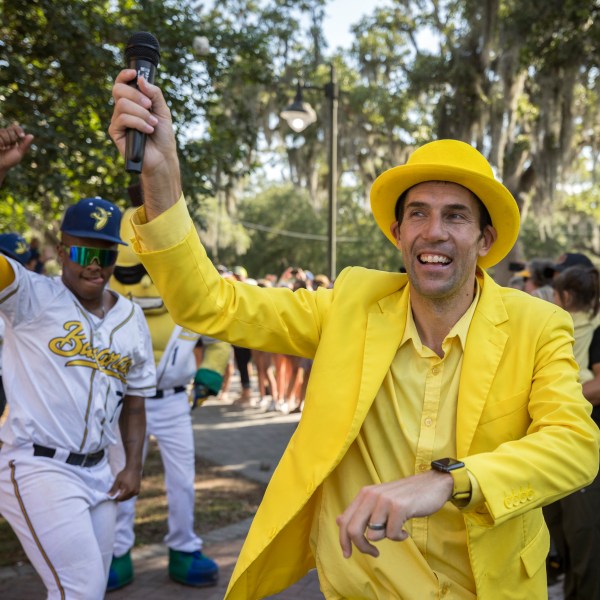 FILE - Savannah Bananas owner Jesse Cole emcees a pregame parade and performance for the fans before the gates open, June 7, 2022, in Savannah, Ga. (AP Photo/Stephen B. Morton, File)