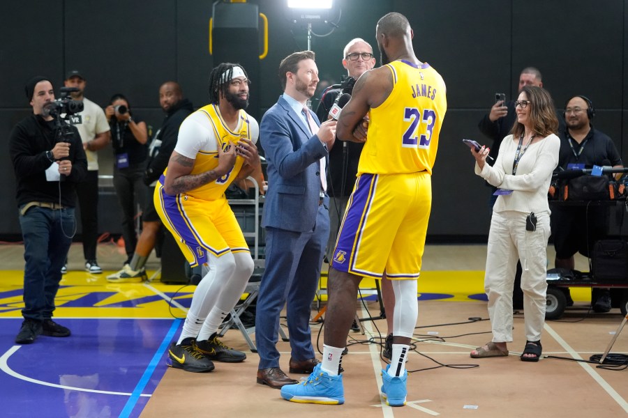 Los Angeles Lakers' Anthony Davis, left, jokes around as LeBron James participates in an interview during the NBA basketball team's media day in El Segundo, Calif., Monday, Sept. 30, 2024. (AP Photo/Jae C. Hong)