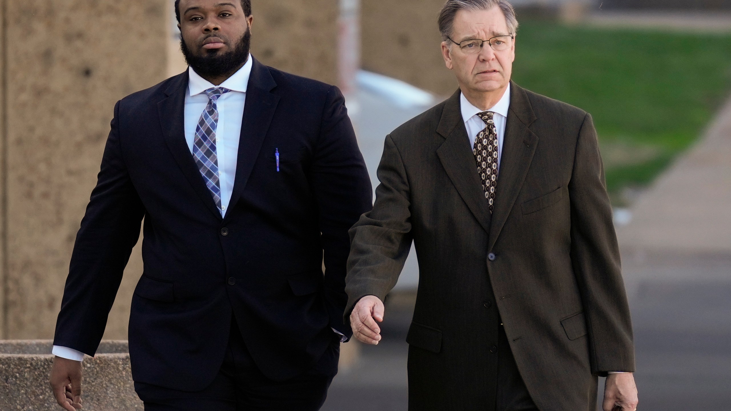 Demetrius Haley, left, one of three former Memphis police officers charged in the 2023 fatal beating of Tyre Nichols, arrives at the federal courthouse with his attorney Michael Stengel, right, for the day's proceedings Thursday, Oct. 3, 2024, in Memphis, Tenn. (AP Photo/George Walker IV)