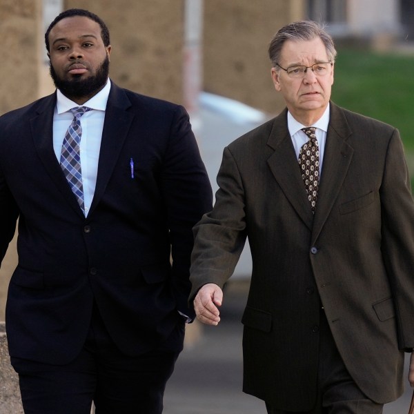 Demetrius Haley, left, one of three former Memphis police officers charged in the 2023 fatal beating of Tyre Nichols, arrives at the federal courthouse with his attorney Michael Stengel, right, for the day's proceedings Thursday, Oct. 3, 2024, in Memphis, Tenn. (AP Photo/George Walker IV)