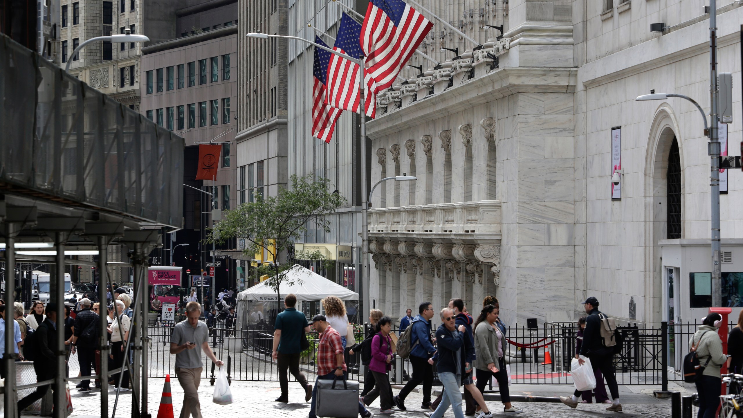 FILE - People pass the New York Stock Exchange on Oct. 1, 2024, in New York. (AP Photo/Peter Morgan, File)