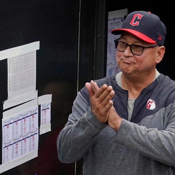 FILE -Cleveland Guardians manager Terry Francona applauds during a tribute video before the team's baseball game against the Cincinnati Reds, Wednesday, Sept. 27, 2023, in Cleveland. Terry Francona has been hired to manage the Cincinnati Reds, returning to the major leagues a year after he stepped down in Cleveland because of health. A person familiar with the situation confirmed the move on Thursday, Oct. 3, 2024 on condition of anonymity because the Reds had not announced the decision.(AP Photo/Sue Ogrocki, File)