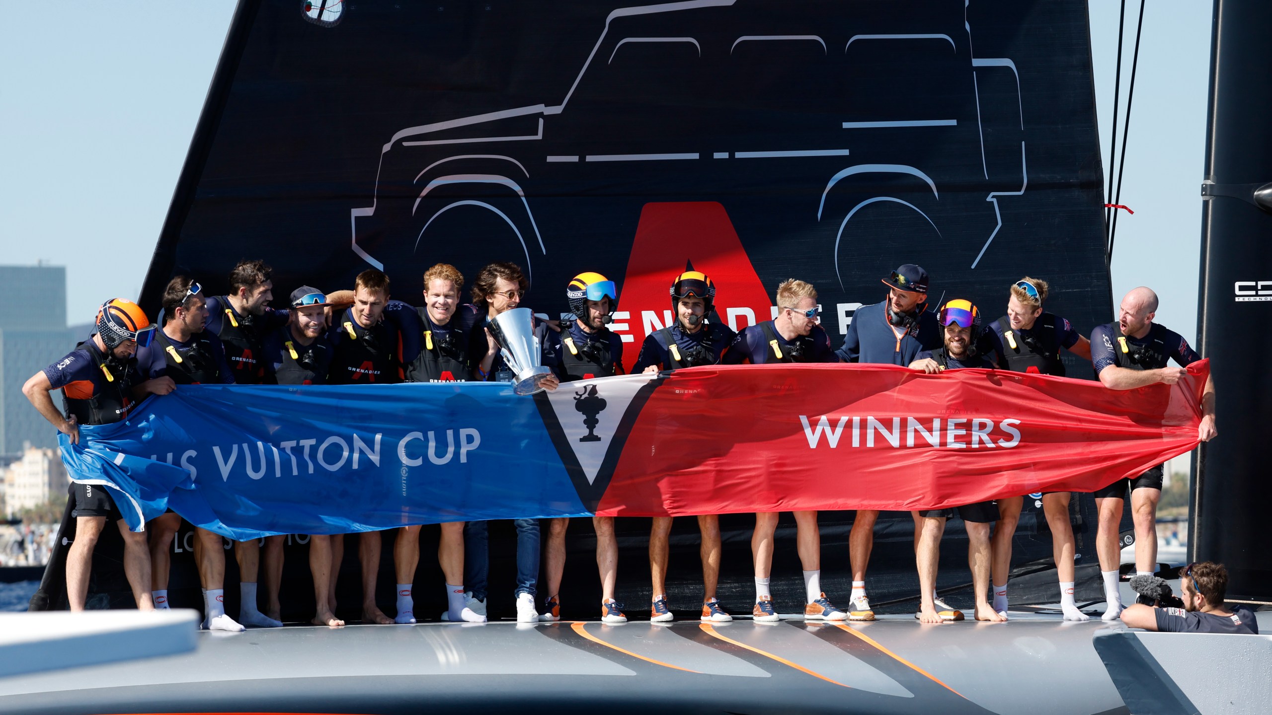 INEOS Britannia crew celebrate their victory against the Luna Rosa Prada Pirelli's sailing team during the Louis Vuitton Cup Final Day 7 at the Barcelona's coast, Spain, Friday, Oct. 4, 2024. (AP Photo/Joan Monfort)