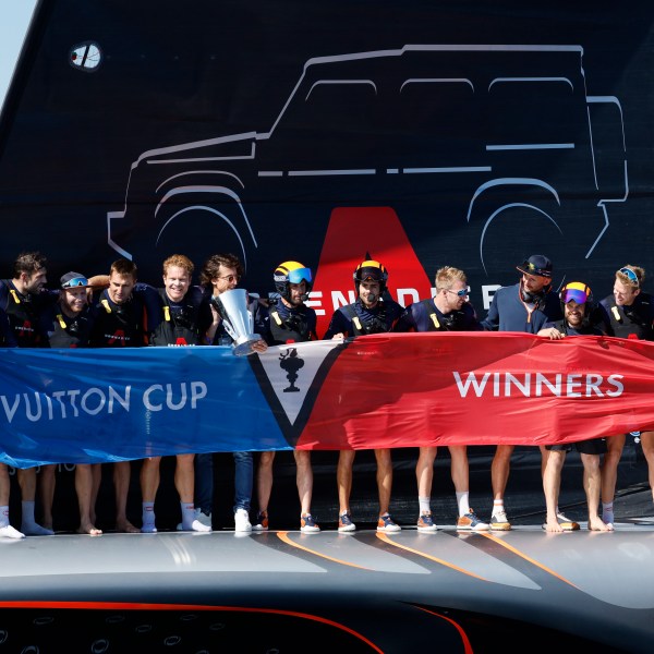 INEOS Britannia crew celebrate their victory against the Luna Rosa Prada Pirelli's sailing team during the Louis Vuitton Cup Final Day 7 at the Barcelona's coast, Spain, Friday, Oct. 4, 2024. (AP Photo/Joan Monfort)