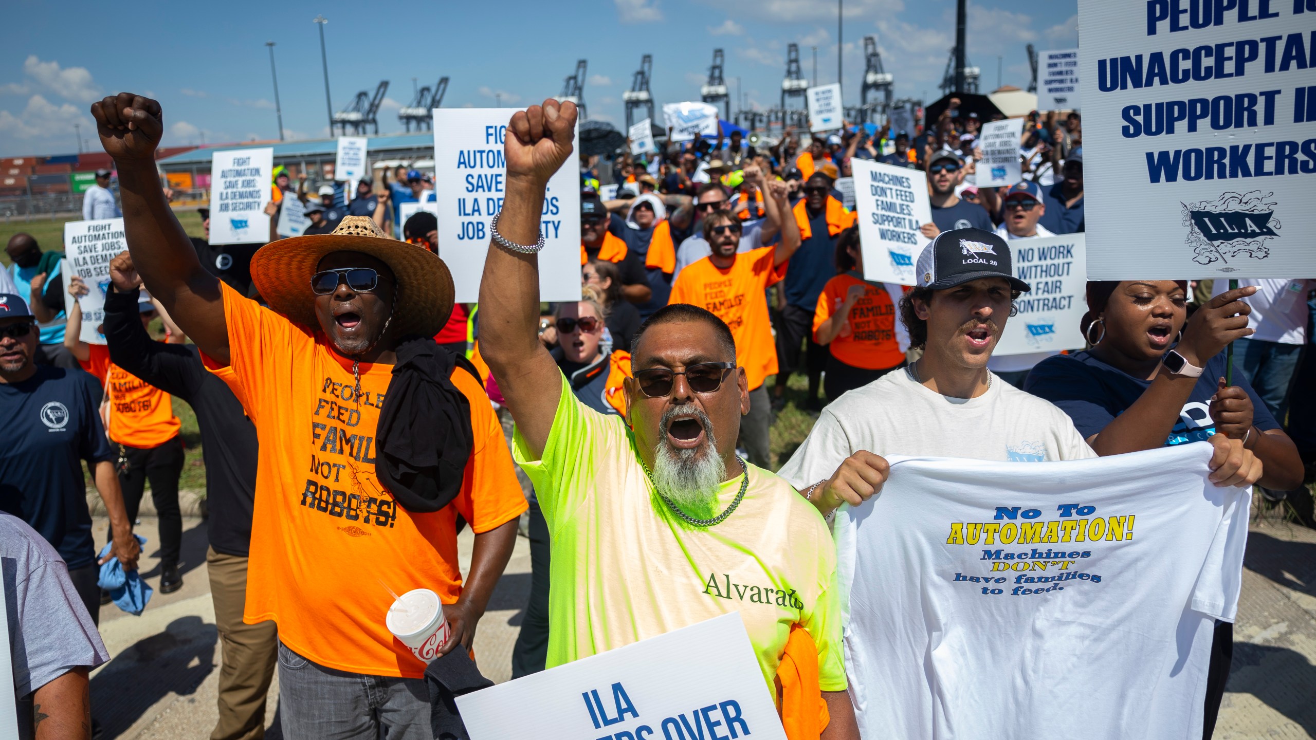 Francisco Alvarado, center, joins other ILA members during a strike at the Bayport Container Terminal on Tuesday, Oct. 1, 2024, in Houston. (AP Photo/Annie Mulligan)