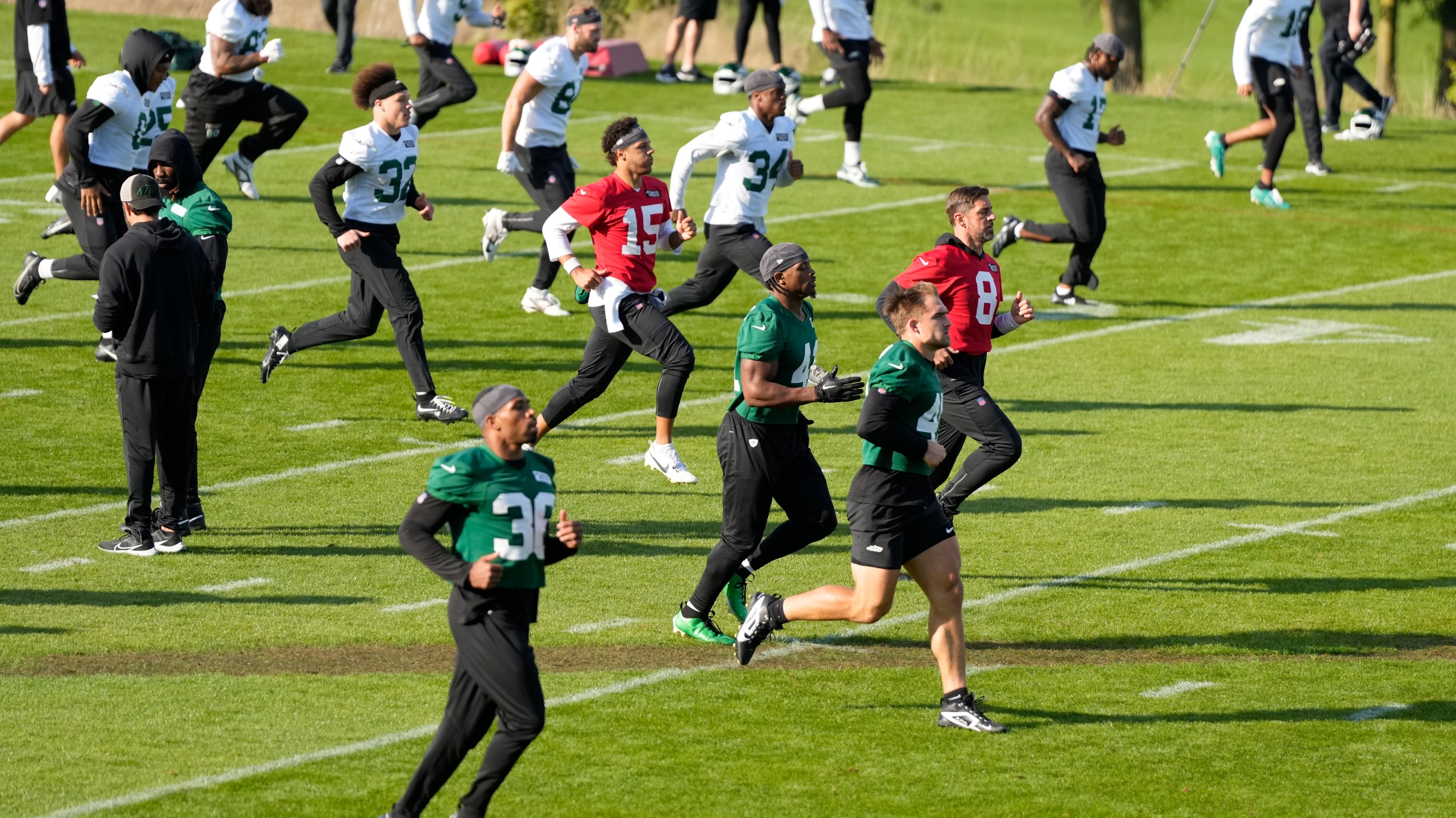 New York Jets quarterback Aaron Rodgers (8) participates in a training session in Ware, England, Friday, Oct. 4, 2024, ahead of the game between New York Jets and Minnesota Vikings at the Tottenham Hotspur stadium on Sunday. (AP Photo/Alastair Grant)