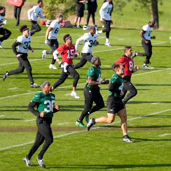 New York Jets quarterback Aaron Rodgers (8) participates in a training session in Ware, England, Friday, Oct. 4, 2024, ahead of the game between New York Jets and Minnesota Vikings at the Tottenham Hotspur stadium on Sunday. (AP Photo/Alastair Grant)