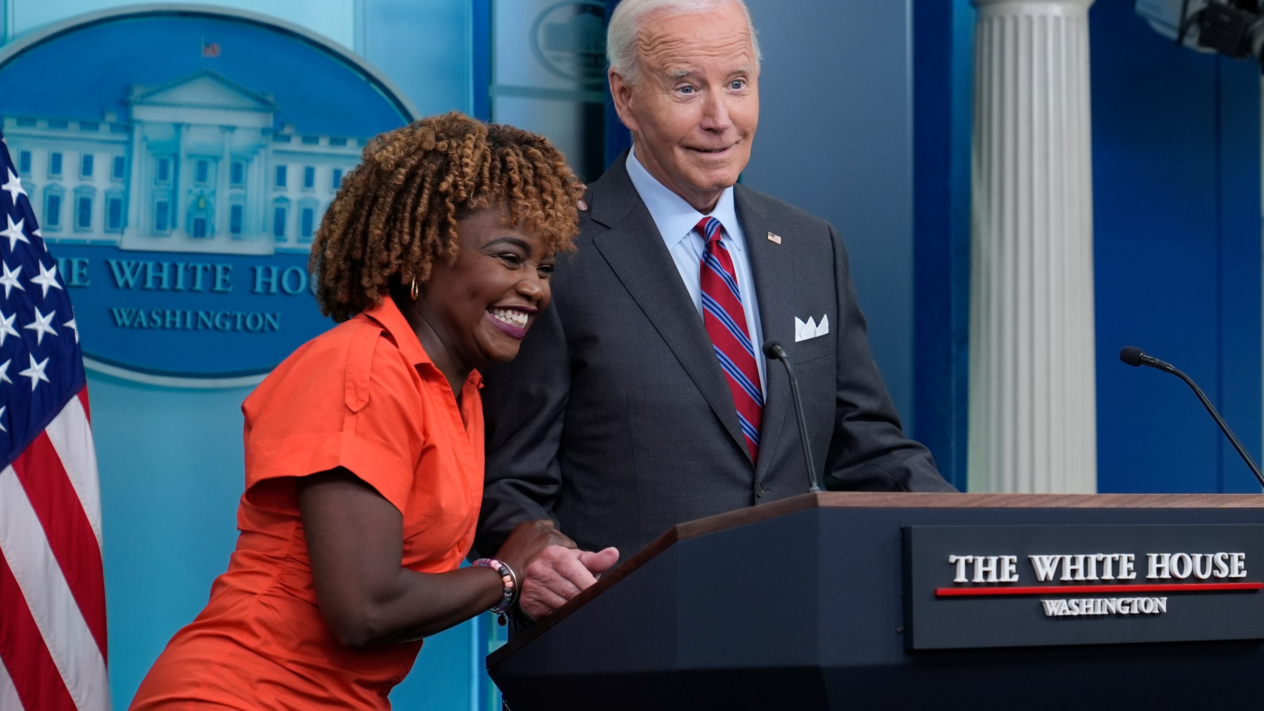 President Joe Biden shares a laugh with White House press secretary Karine Jean-Pierre when Biden made a surprise appearance during the daily briefing at the White House in Washington, Friday, Oct. 4, 2024. (AP Photo/Susan Walsh)