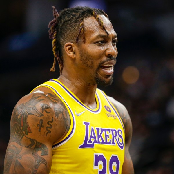 FILE - Los Angeles Lakers center Dwight Howard looks on during an NBA basketball game against the Minnesota Timberwolves, March 16, 2022, in Minneapolis. (AP Photo/Andy Clayton-King, File)