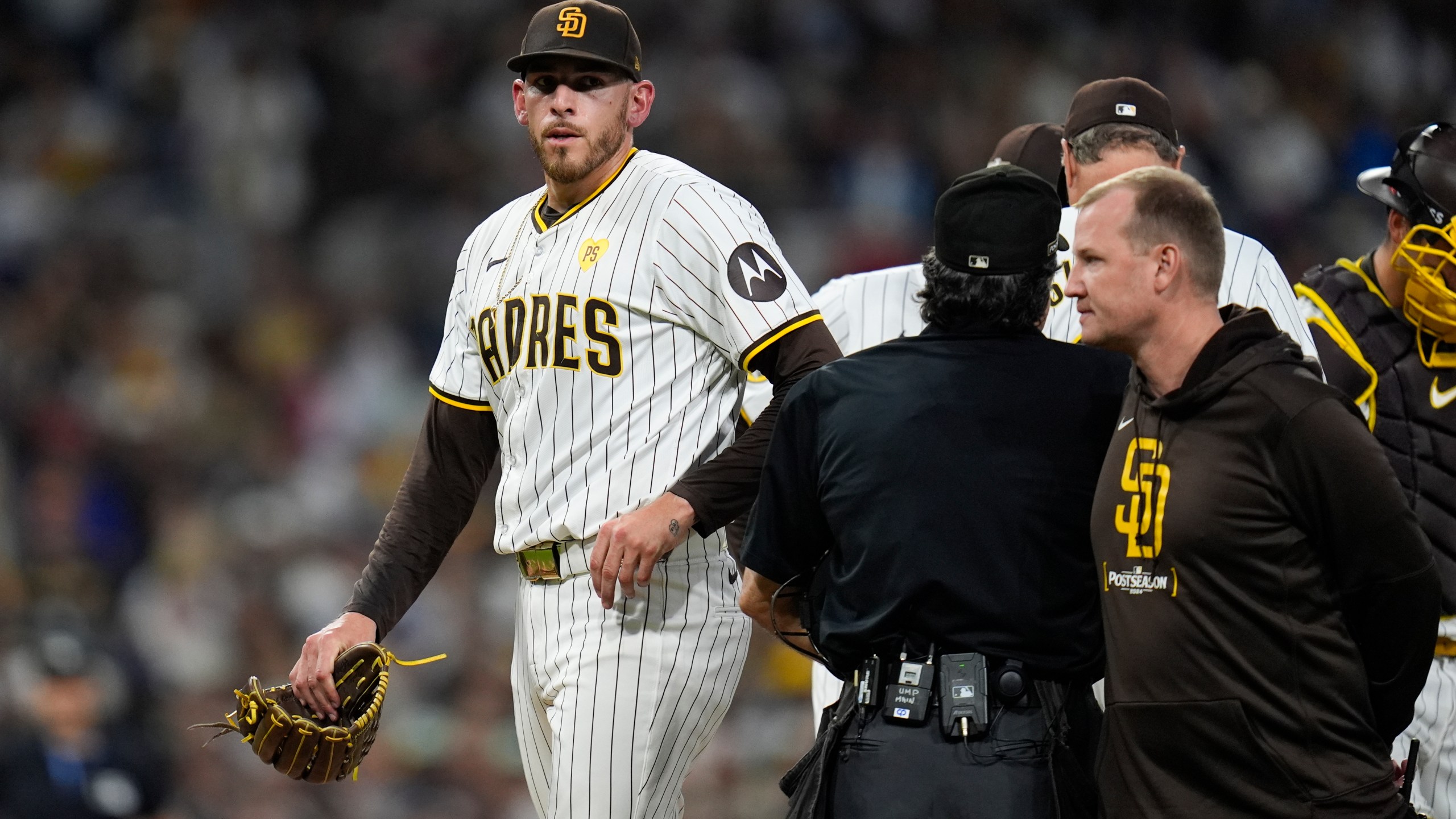 San Diego Padres starting pitcher Joe Musgrove exits the game during the fourth inning in Game 2 of an NL Wild Card Series baseball game against the Atlanta Braves, Wednesday, Oct. 2, 2024, in San Diego. (AP Photo/Gregory Bull)