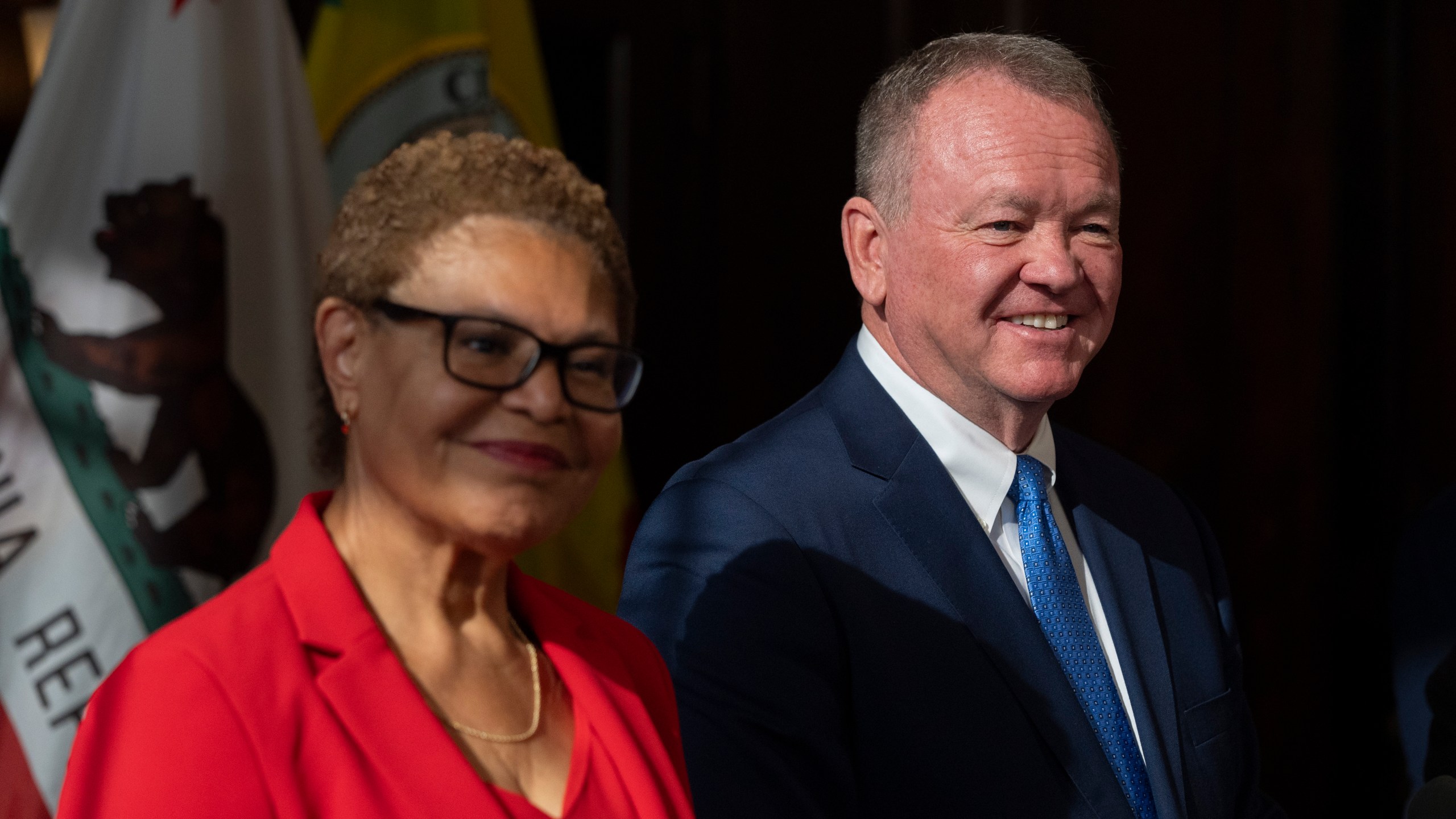 Los Angeles Mayor Karen Bass, left, and newly appointed police chief Jim McDonnell listen to questions from the media during a news conference in Los Angeles, Friday, Oct. 4, 2024. (AP Photo/Jae C. Hong)