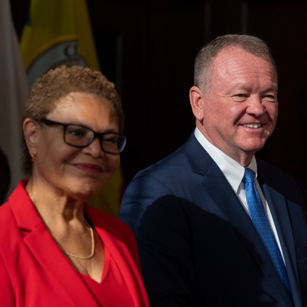 Los Angeles Mayor Karen Bass, left, and newly appointed police chief Jim McDonnell listen to questions from the media during a news conference in Los Angeles, Friday, Oct. 4, 2024. (AP Photo/Jae C. Hong)