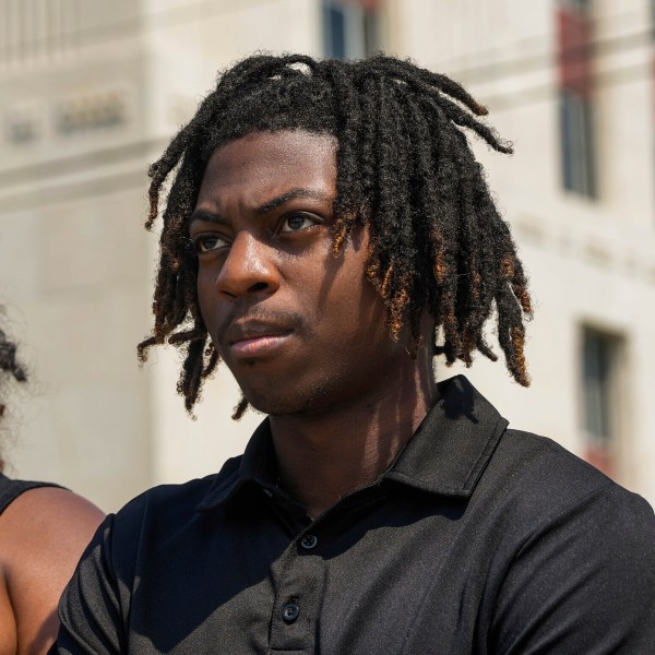 FILE - Darryl George stands next to his mother, Darresha George, in front of Galveston County Court House, May 23, 2024, in Galveston, Texas. A federal judge on Friday, Oct. 4, 2024 denied a request by Darryl George, a Black high school student in Texas for a court order that the student’s lawyers say would have allowed him to return to his high school without fear of having his previous punishment over his hairstyle resume.(Raquel Natalicchio/Houston Chronicle via AP, File)