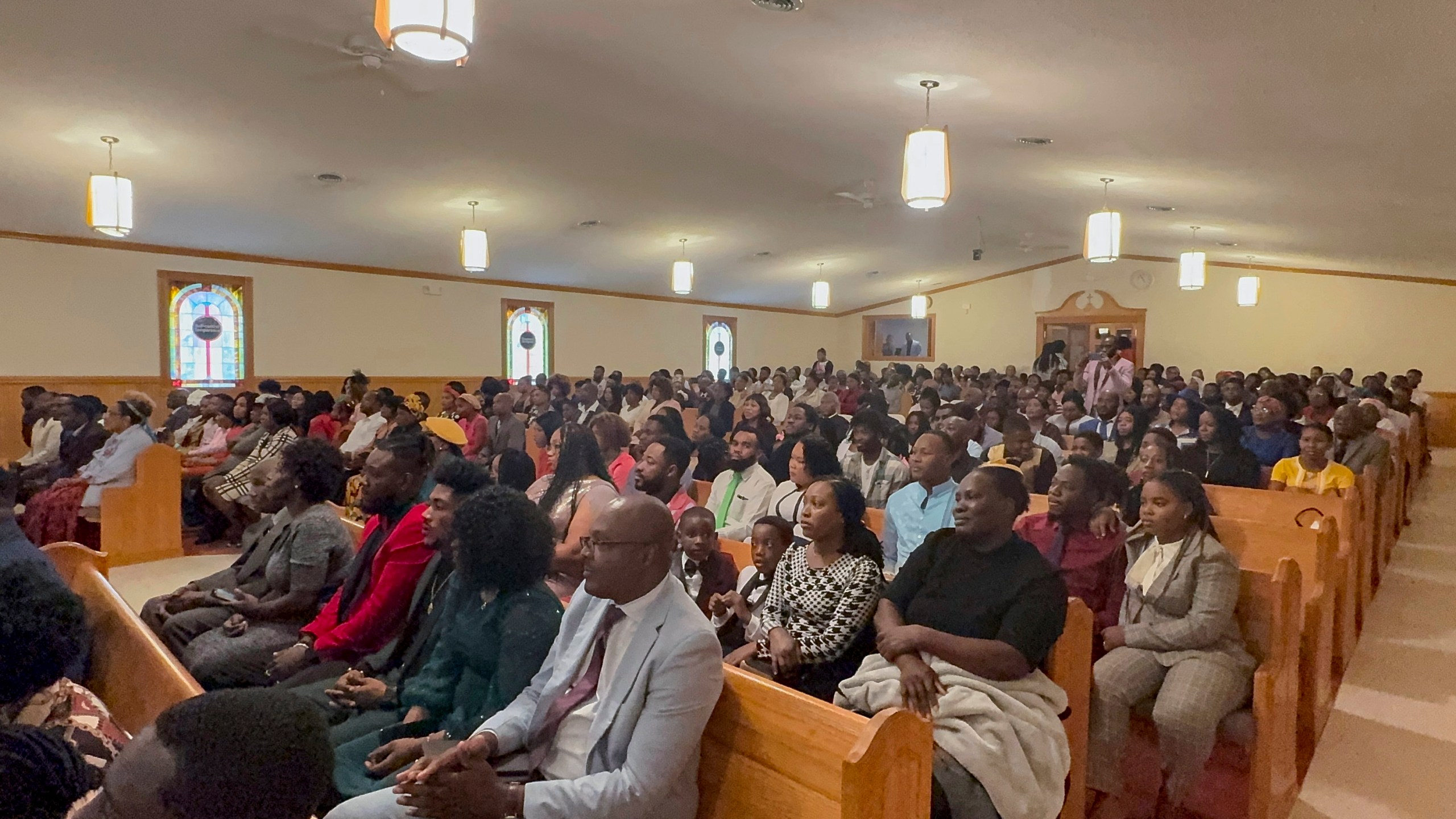 Congregants attend Eglise Porte Etroite, a Creole-language church which has gone from seven attendees to close to 300 in under 15 years, in Albertville, Ala., Sept. 29, 2024. (AP Photo/Safiyah Riddle)