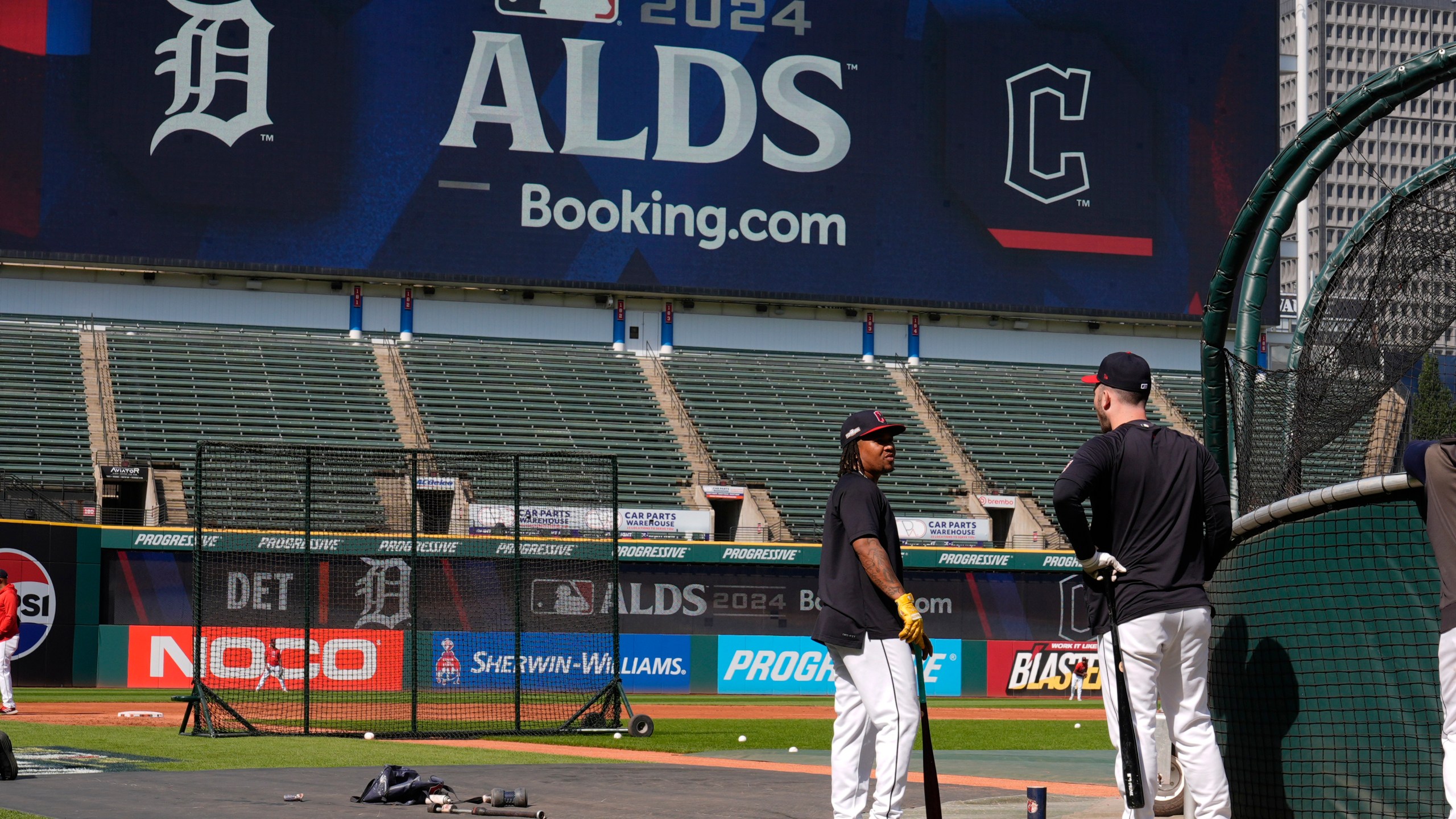 Cleveland Guardians' Jose Ramirez, left, and David Fry, right, talk near the batting cage during a baseball workout in Cleveland, Friday, Oct. 4, 2024, in preparation for the American League Division Series against the Detroit Tigers. (AP Photo/Sue Ogrocki)