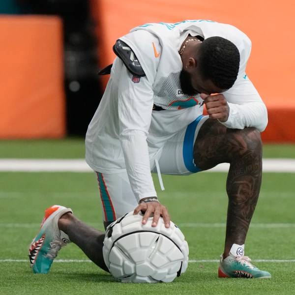 Miami Dolphins wide receiver Odell Beckham Jr. takes a moment during practice at the NFL football team's training facility, Thursday, Oct. 3, 2024, in Miami Gardens, Fla. (AP Photo/Lynne Sladky)