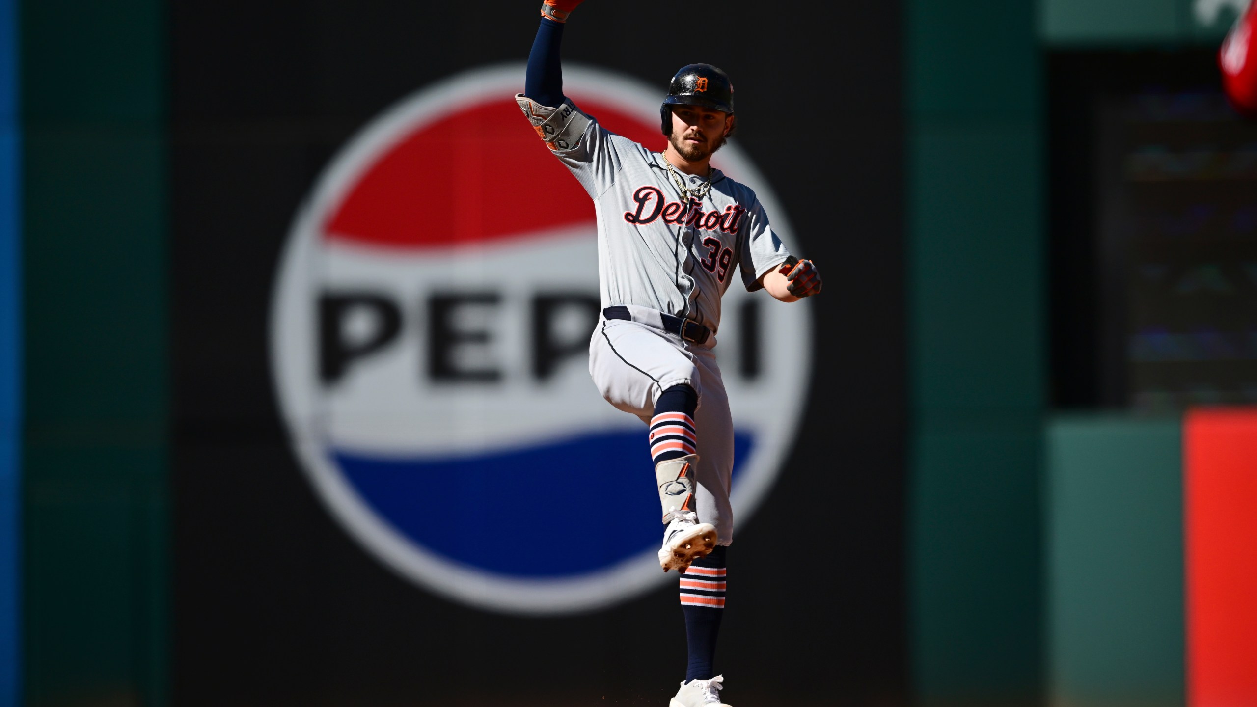 Detroit Tigers' Zach McKinstry celebrates a hitting a double at second base during the second inning of Game 1 of baseball's AL Division Series against the Cleveland Guardians, Saturday, Oct. 5, 2024, in Cleveland. (AP Photo/David Dermer)