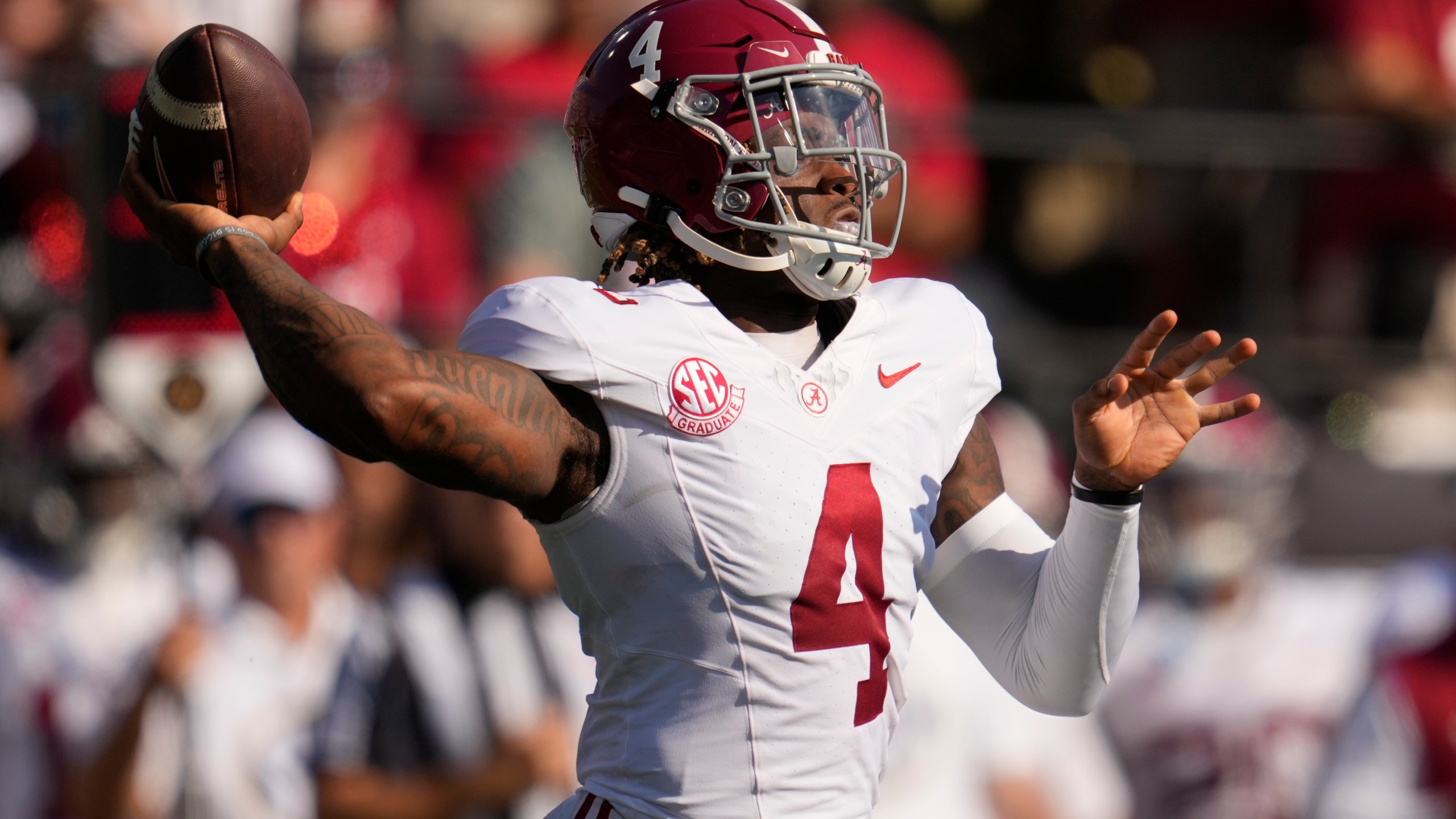 Alabama quarterback Jalen Milroe (4) looks to throw a pass during the first half of an NCAA college football game against Vanderbilt, Saturday, Oct. 5, 2024, in Nashville, Tenn. (AP Photo/George Walker IV)