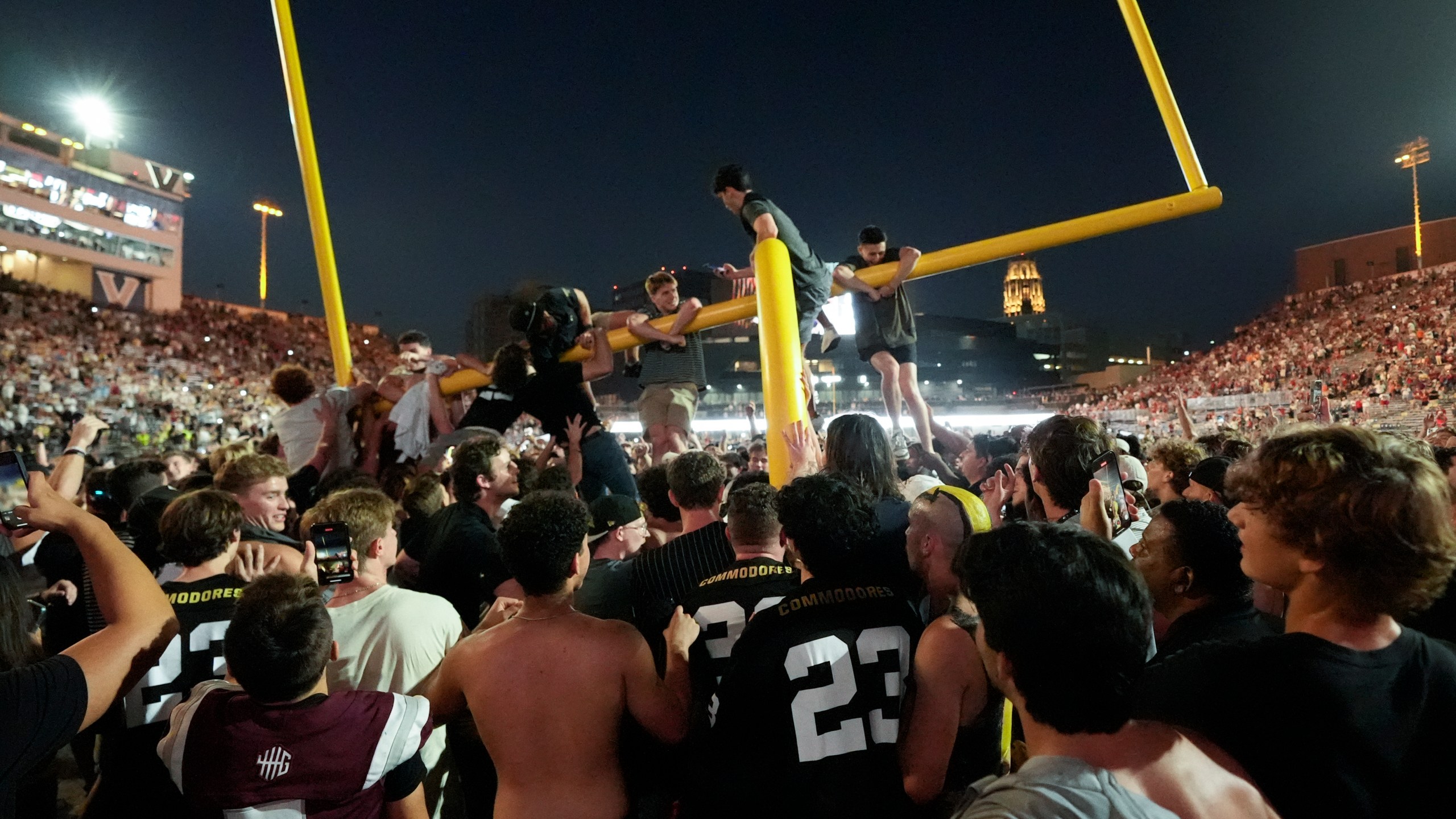 Vanderbilt fans tear down the goal post the after team's 40-35 win over No. 1 Alabama in an NCAA college football game Saturday, Oct. 5, 2024, in Nashville, Tenn. (AP Photo/George Walker IV)