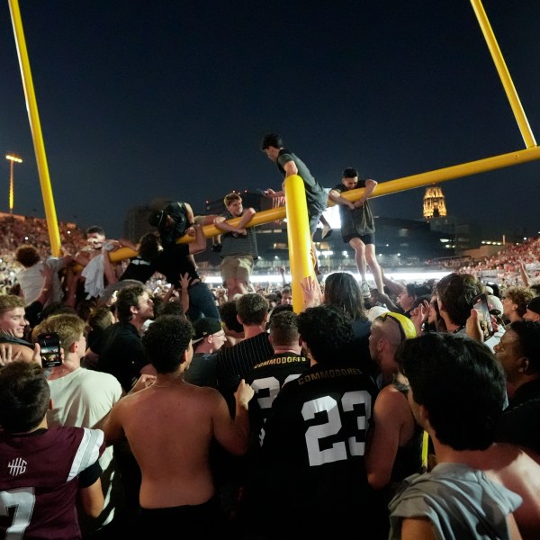 Vanderbilt fans tear down the goal post the after team's 40-35 win over No. 1 Alabama in an NCAA college football game Saturday, Oct. 5, 2024, in Nashville, Tenn. (AP Photo/George Walker IV)