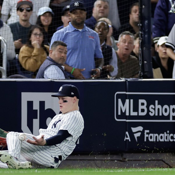 New York Yankees outfielder Alex Verdugo (24) comes up with the catch on a fly ball hit by Kansas City Royals' Michael Massey to end the fourth inning during Game 1 of the American League baseball division series, Saturday, Oct. 5, 2024, in New York. (AP Photo/Adam Hunger)