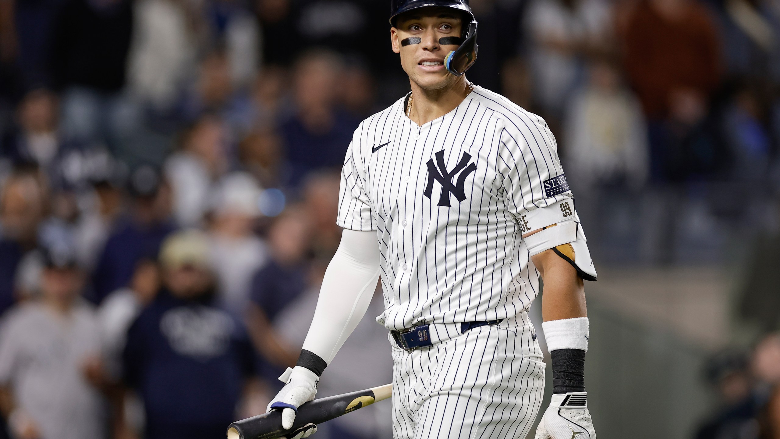 New York Yankees outfielder Aaron Judge (99) reacts after striking out against the Kansas City Royals during the sixth inning of Game 1 of the American League baseball division series, Saturday, Oct. 5, 2024, in New York. (AP Photo/Adam Hunger)