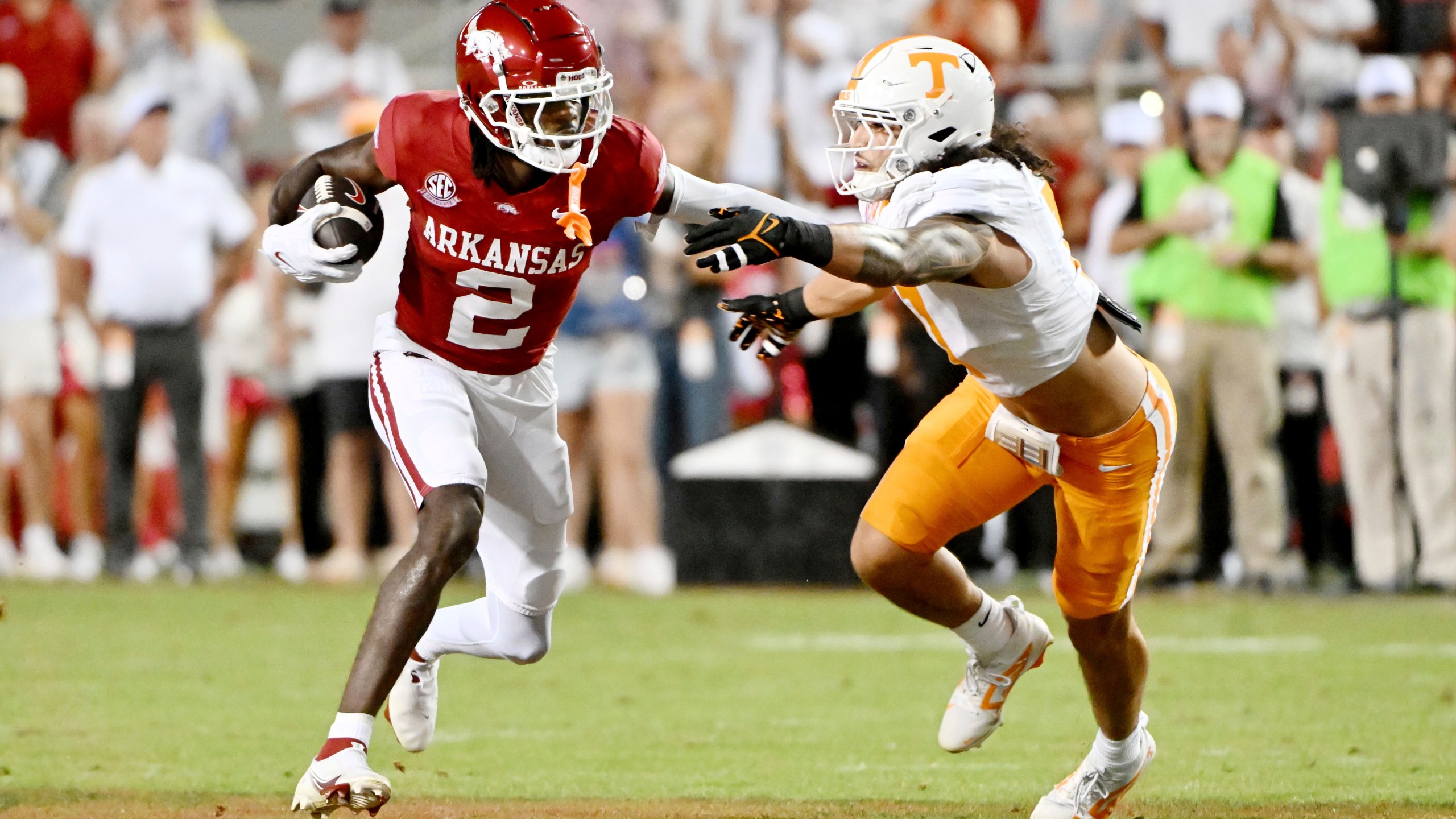 Arkansas wide receiver Andrew Armstrong (2) tries to get past Tennessee linebacker Keenan Pili (11) during the first half of an NCAA college football game, Saturday, Oct. 5, 2024, in Fayetteville, Ark. (AP Photo/Michael Woods)