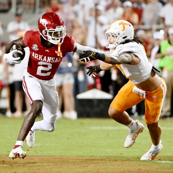 Arkansas wide receiver Andrew Armstrong (2) tries to get past Tennessee linebacker Keenan Pili (11) during the first half of an NCAA college football game, Saturday, Oct. 5, 2024, in Fayetteville, Ark. (AP Photo/Michael Woods)