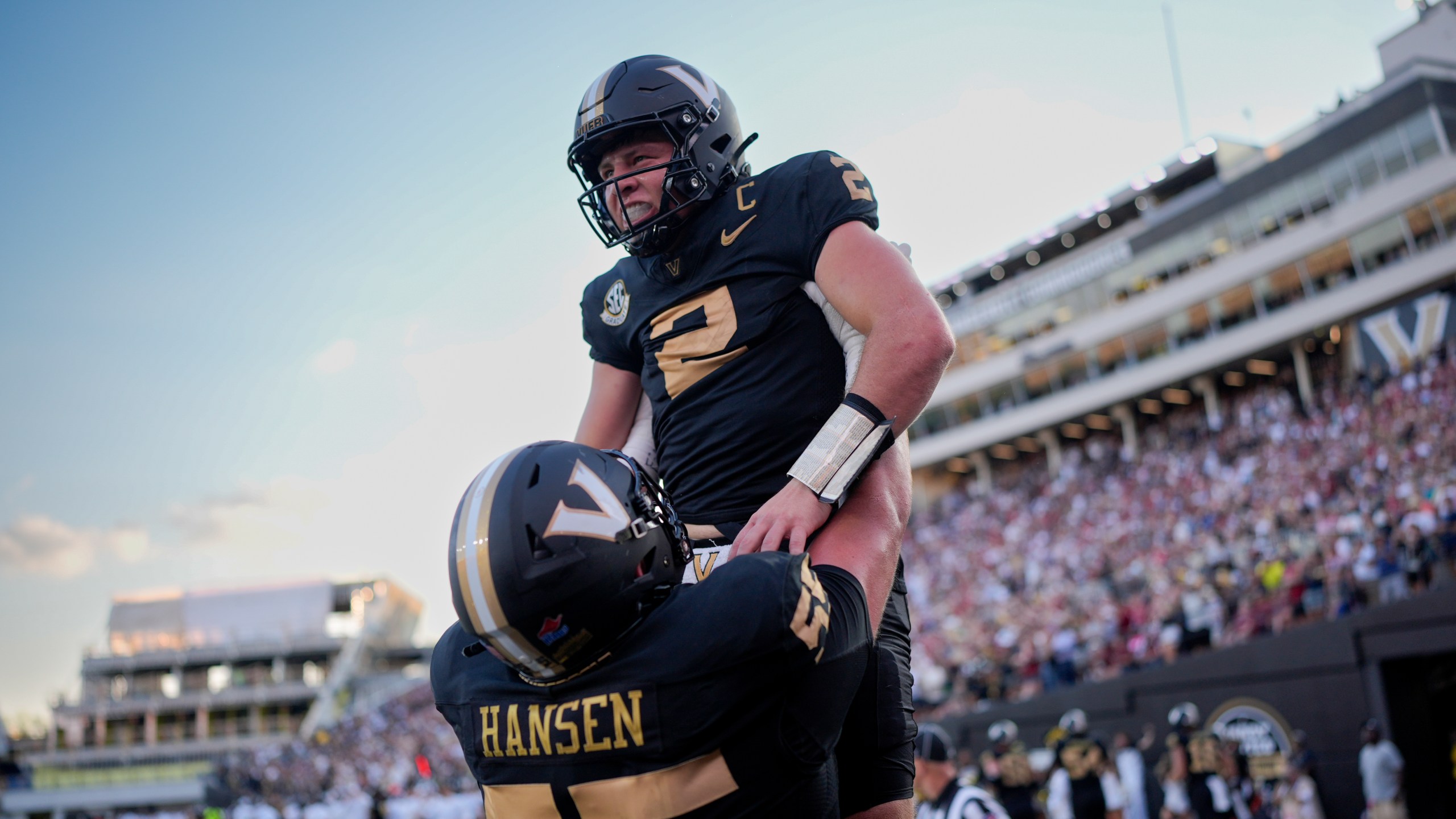 Vanderbilt quarterback Diego Pavia (2) celebrates a touchdown with offensive lineman Gunnar Hansen (55) during the second half of an NCAA college football game against Alabama, Saturday, Oct. 5, 2024, in Nashville, Tenn. (AP Photo/George Walker IV)