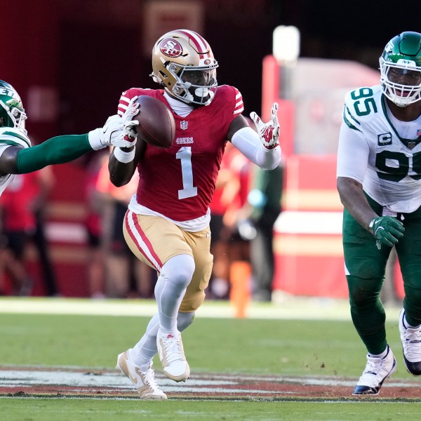 San Francisco 49ers wide receiver Deebo Samuel Sr. (1) runs between New York Jets linebacker C.J. Mosley and defensive tackle Quinnen Williams (95) during the first half of an NFL football game in Santa Clara, Calif., Monday, Sept. 9, 2024. (AP Photo/Godofredo A. Vásquez)