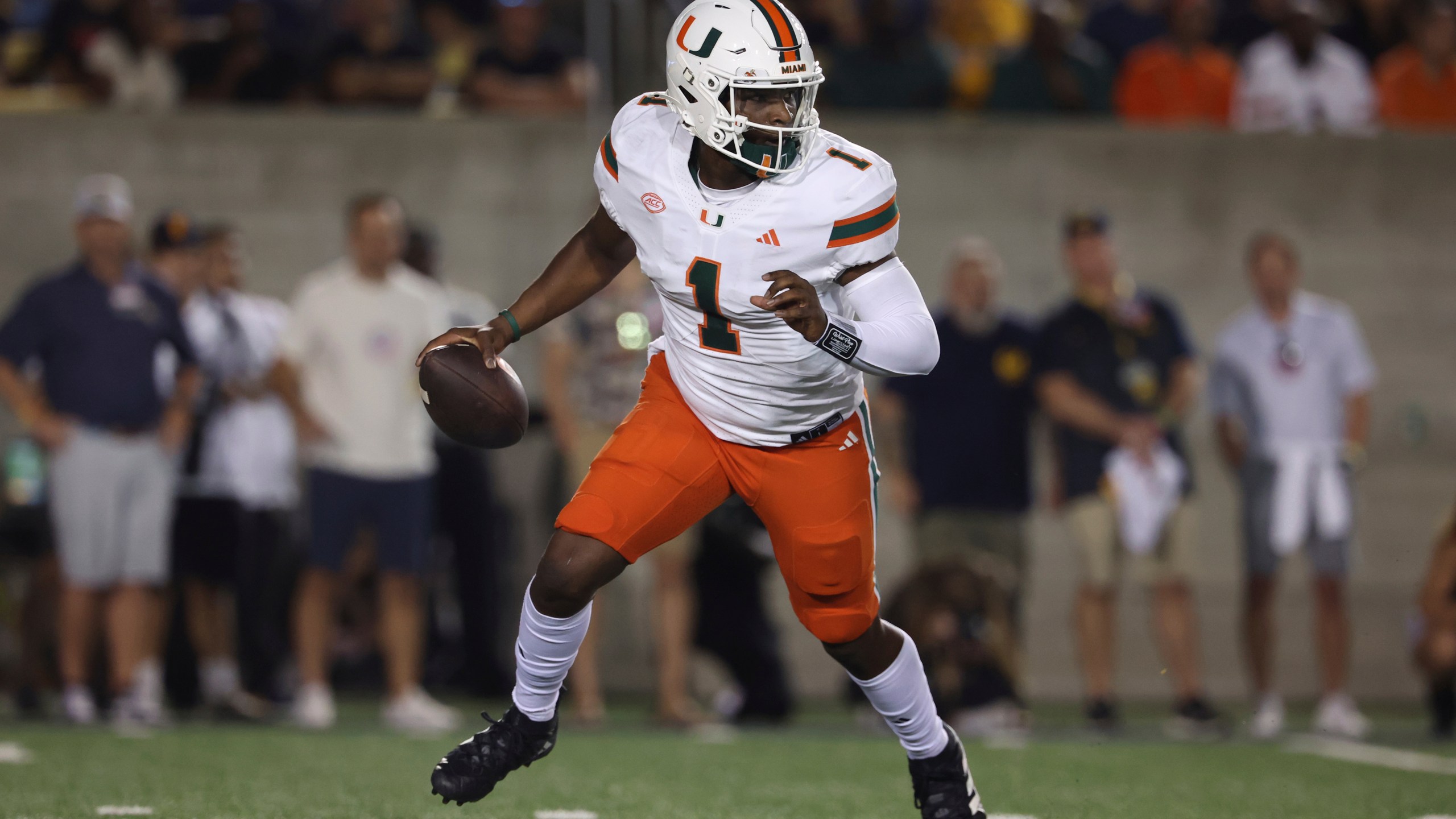 Miami quarterback Cam Ward (1) runs against California during the first half of an NCAA college football game in Berkeley, Calif., Saturday, Oct. 5, 2024. (AP Photo/Jed Jacobsohn)