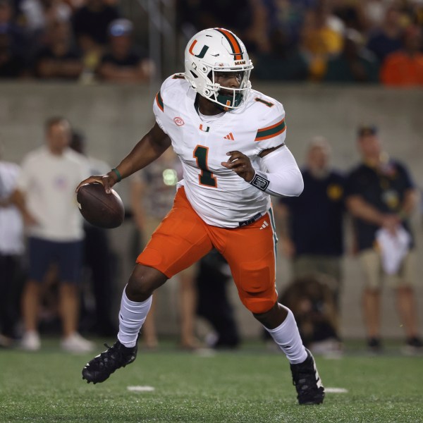 Miami quarterback Cam Ward (1) runs against California during the first half of an NCAA college football game in Berkeley, Calif., Saturday, Oct. 5, 2024. (AP Photo/Jed Jacobsohn)