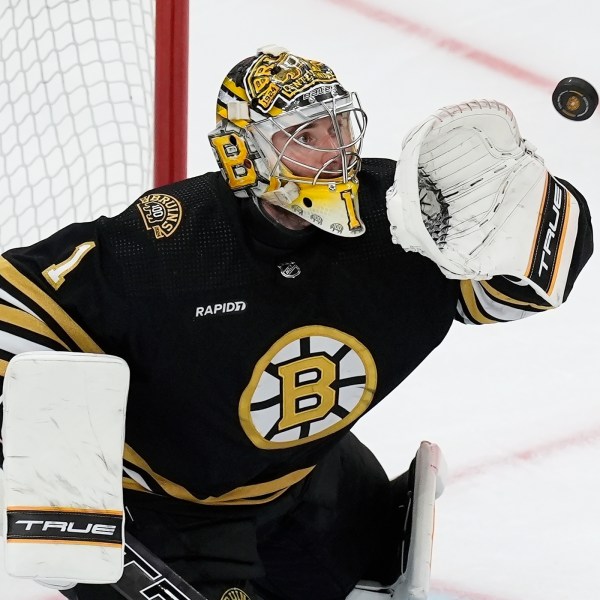 FILE - Boston Bruins' Jeremy Swayman makes a glove save during the third period in Game 6 of an NHL hockey Stanley Cup second-round playoff series against the Florida Panthers, May 17, 2024, in Boston. (AP Photo/Michael Dwyer, File)