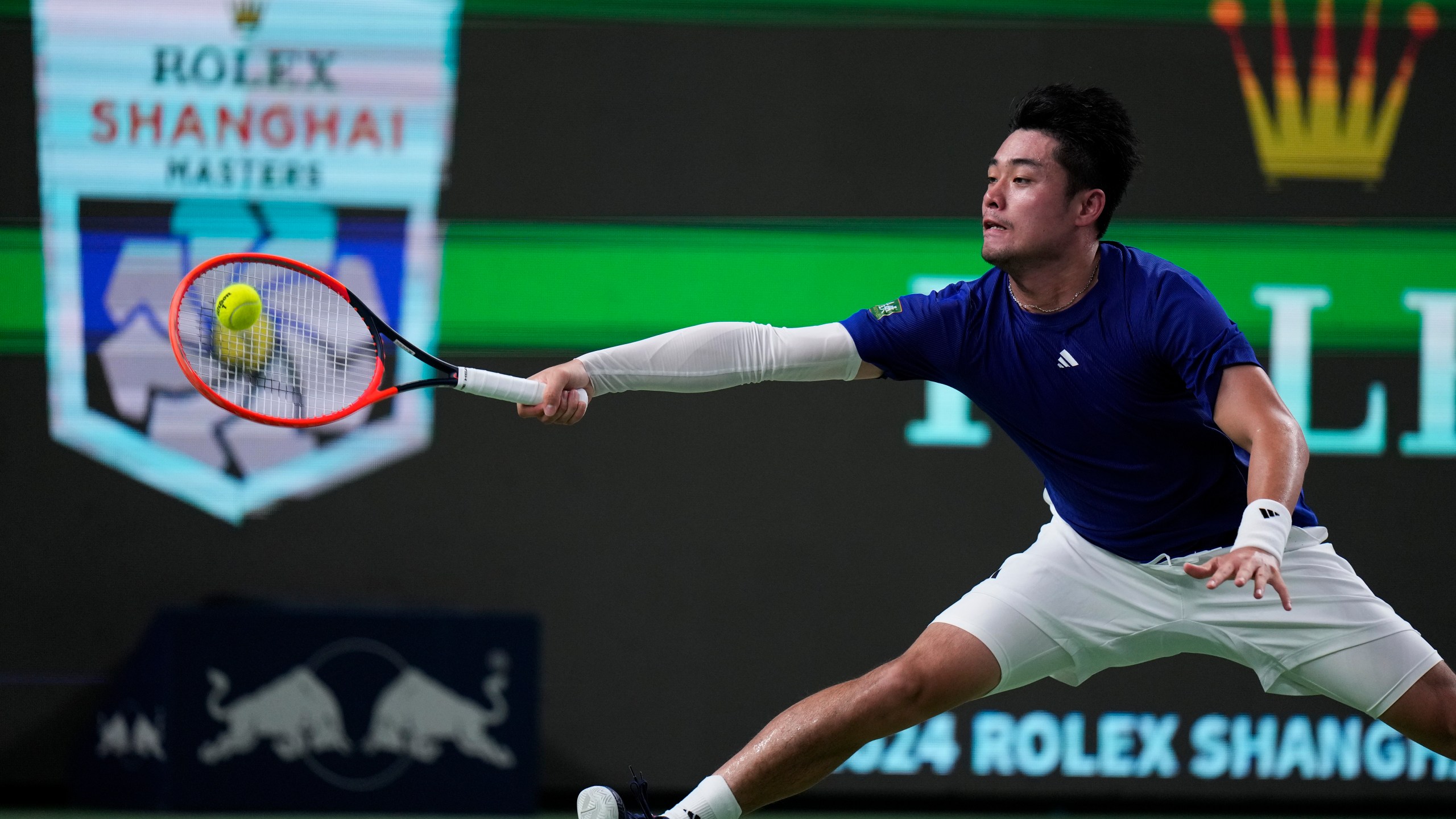 Wu Yibing of China returns a forehand shot to Carlos Alcaraz of Spain during the men's singles third round match of the Shanghai Masters tennis tournament at Qizhong Forest Sports City Tennis Center in Shanghai, China, Sunday, Oct. 6, 2024. (AP Photo/Andy Wong)