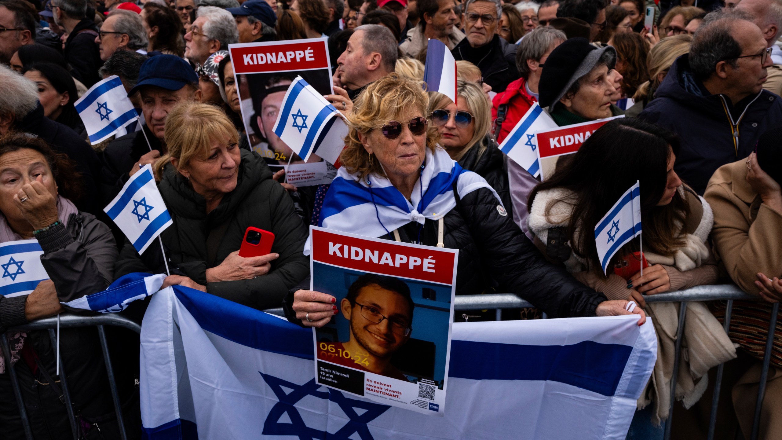 People attend a demonstration in support of Israel to mark the first anniversary of the Hamas attack on Israel, in Paris, Sunday, Oct. 6, 2024.(AP Photo/Louise Delmotte)