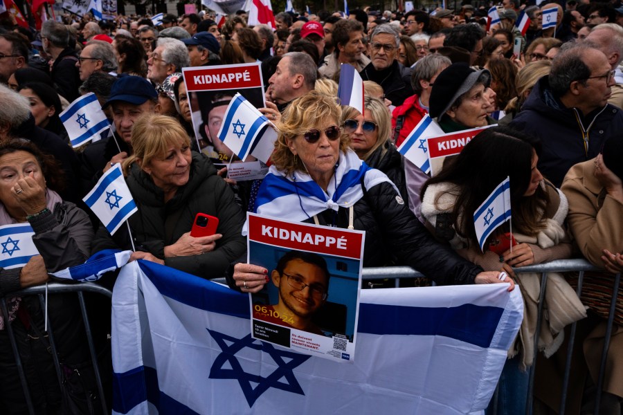 People attend a demonstration in support of Israel to mark the first anniversary of the Hamas attack on Israel, in Paris, Sunday, Oct. 6, 2024.(AP Photo/Louise Delmotte)