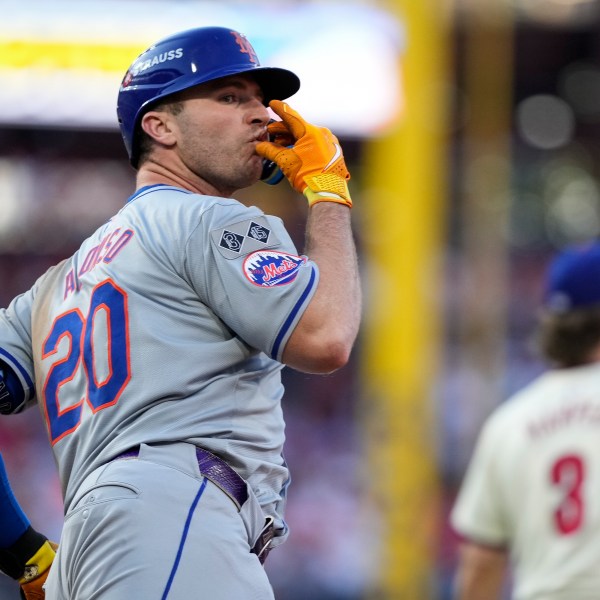 New York Mets' Pete Alonso reacts after hitting a home run against Philadelphia Phillies pitcher José Ruiz during the sixth inning of Game 2 of a baseball NL Division Series, Sunday, Oct. 6, 2024, in Philadelphia. (AP Photo/Matt Slocum)