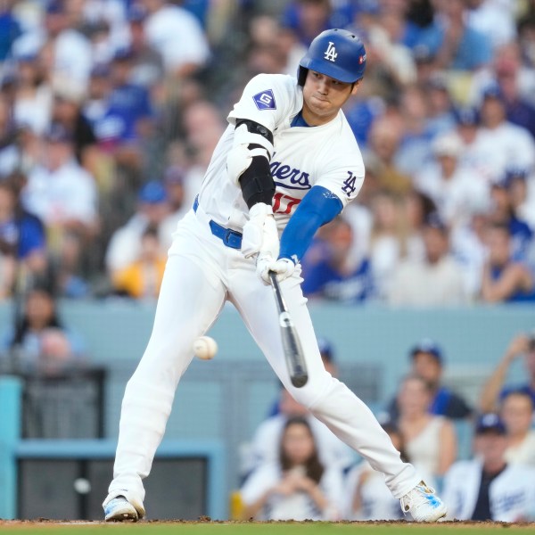 Los Angeles Dodgers' Shohei Ohtani grounds out during the third inning in Game 2 of a baseball NL Division Series against the San Diego Padres, Sunday, Oct. 6, 2024, in Los Angeles. (AP Photo/Ashley Landis)