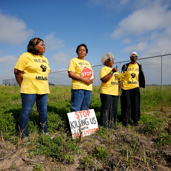 FILE - From left, Myrtle Felton, Sharon Lavigne, Gail LeBoeuf and Rita Cooper, members of RISE St. James, conduct a live stream video on property owned by Formosa in St. James Parish, La., Wednesday, March 11, 2020. (AP Photo/Gerald Herbert, File)