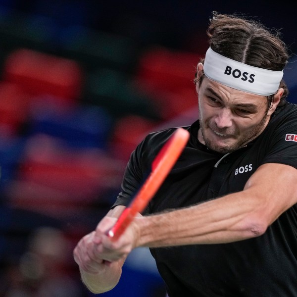 Taylor Fritz of the United States returns a shot to Terence Atmane of France during the men's singles second round match in the Shanghai Masters tennis tournament at Qizhong Forest Sports City Tennis Center in Shanghai, China, Monday, Oct. 7, 2024. (AP Photo/Andy Wong)