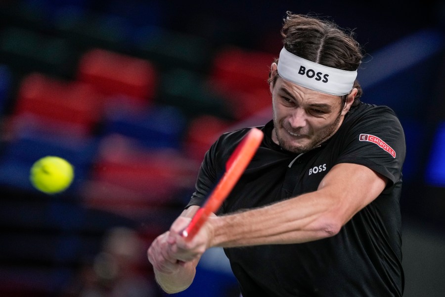 Taylor Fritz of the United States returns a shot to Terence Atmane of France during the men's singles second round match in the Shanghai Masters tennis tournament at Qizhong Forest Sports City Tennis Center in Shanghai, China, Monday, Oct. 7, 2024. (AP Photo/Andy Wong)