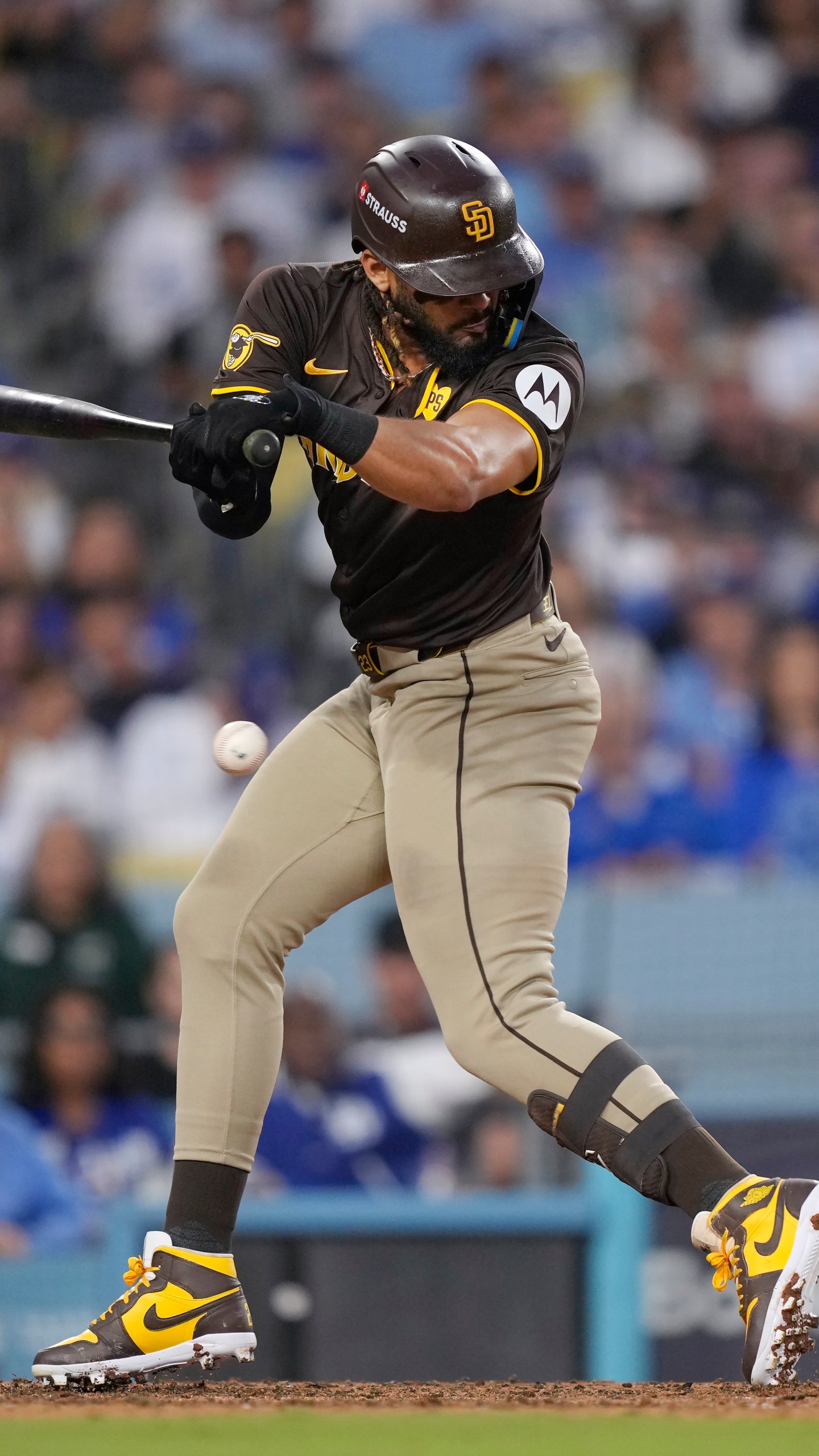 San Diego Padres' Fernando Tatis Jr. is hit by a pitch during the sixth inning in Game 2 of a baseball NL Division Series against the Los Angeles Dodgers, Sunday, Oct. 6, 2024, in Los Angeles. (AP Photo/Mark J. Terrill)