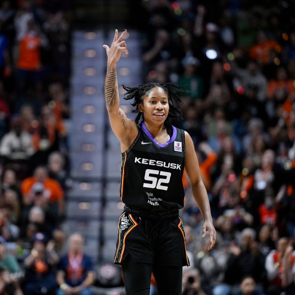 Connecticut Sun guard Tyasha Harris Reacts after making a three point basket during the second half of Game 4 in the WNBA basketball semifinals against the Minnesota Lynx, Sunday, Oct. 6, 2024, in Uncasville, Conn. (AP Photo/Jessica Hill)